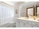 Bright bathroom features stylish mosaic tile, updated vanity, and shower at 12117 Cliffside Cir, Raleigh, NC 27614