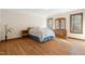 Spacious bedroom showcasing hardwood floors, natural light and wooden windows at 12117 Cliffside Cir, Raleigh, NC 27614
