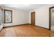 Empty bedroom showing hardwood floors, natural light and wood trim window at 12117 Cliffside Cir, Raleigh, NC 27614