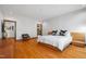 Spacious bedroom with hardwood floors and contemporary decor and plenty of natural light at 12117 Cliffside Cir, Raleigh, NC 27614