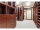 Spacious walk-in closet with custom shelving and ample storage space at 12117 Cliffside Cir, Raleigh, NC 27614