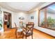 Elegant dining room with wood floors and a large window at 12117 Cliffside Cir, Raleigh, NC 27614