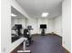 Well-equipped exercise room with stationary bikes, TV, rubber floor, and large mirror at 12117 Cliffside Cir, Raleigh, NC 27614