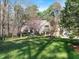 Attractive home featuring a well-manicured lawn and mature landscaping at 12117 Cliffside Cir, Raleigh, NC 27614