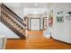 Bright foyer featuring hardwood floors, staircase, and ample natural light at 12117 Cliffside Cir, Raleigh, NC 27614