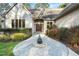 Beautiful home entrance with a stone walkway and water feature at 12117 Cliffside Cir, Raleigh, NC 27614