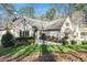 Inviting front entrance with a stone pathway and manicured bushes at 12117 Cliffside Cir, Raleigh, NC 27614