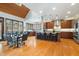 Open kitchen featuring a large island with seating, skylight, dark wood cabinets, and stainless steel appliances at 12117 Cliffside Cir, Raleigh, NC 27614