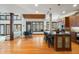 Open kitchen with a large island, bar stool seating, adjacent to a dining area, and natural light at 12117 Cliffside Cir, Raleigh, NC 27614