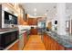Spacious kitchen with a large island, breakfast bar, modern appliances, and ample counter space at 12117 Cliffside Cir, Raleigh, NC 27614