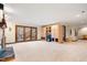 Large living area showcases a fireplace, built-in cabinets, and outdoor access at 12117 Cliffside Cir, Raleigh, NC 27614
