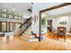 Bright living room with wood staircase and an adjacent dining space at 12117 Cliffside Cir, Raleigh, NC 27614