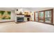 Spacious basement living room with carpet, fireplace, and walkout access at 12117 Cliffside Cir, Raleigh, NC 27614