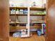 Well-organized pantry with ample shelving for food and storage at 12117 Cliffside Cir, Raleigh, NC 27614