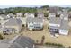 This aerial view shows the home's large, well-maintained yard in a quiet residential neighborhood at 1212 Stonemill Falls Dr, Wake Forest, NC 27587