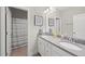 Bright bathroom featuring double sinks with granite counters, and a separate shower/toilet room at 1212 Stonemill Falls Dr, Wake Forest, NC 27587