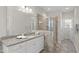 Updated bathroom featuring a glass-enclosed shower with tile surround and a vanity with granite counters at 1212 Stonemill Falls Dr, Wake Forest, NC 27587