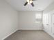 Bright bedroom with neutral walls, carpet, ceiling fan and a double door closet at 1212 Stonemill Falls Dr, Wake Forest, NC 27587