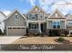 Charming two-story home with a manicured lawn, attached garage, and welcoming front porch, creating instant curb appeal at 1212 Stonemill Falls Dr, Wake Forest, NC 27587