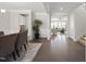 Spacious foyer with elegant hardwood floors and neutral walls, creating a welcoming entrance to the home at 1212 Stonemill Falls Dr, Wake Forest, NC 27587