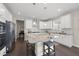 Bright kitchen with stainless steel appliances, granite countertops, and a central island with seating at 1212 Stonemill Falls Dr, Wake Forest, NC 27587