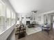 Bright living room featuring a fireplace, built-in shelves, and large windows that bring in natural light at 1212 Stonemill Falls Dr, Wake Forest, NC 27587