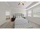 Main bedroom featuring a trey ceiling, ensuite bath, and neutral decor at 1212 Stonemill Falls Dr, Wake Forest, NC 27587