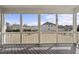 Relax on the screened porch and enjoy the backyard view at 1212 Stonemill Falls Dr, Wake Forest, NC 27587