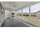Relax on the screened porch with outdoor ceiling fan and enjoy the backyard view at 1212 Stonemill Falls Dr, Wake Forest, NC 27587
