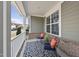 Relax on this cozy front porch with comfortable seating, offering a perfect spot to enjoy the outdoors at 1212 Stonemill Falls Dr, Wake Forest, NC 27587