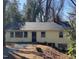 Inviting home with a new roof and gravel walkway, nestled on a landscaped lot at 123 Barclay Rd, Chapel Hill, NC 27516