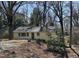 Charming single-story home featuring a well-maintained yard and mature trees at 123 Barclay Rd, Chapel Hill, NC 27516