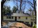 Quaint home showcasing fresh paint, a dark roof, and meticulous landscaping at 123 Barclay Rd, Chapel Hill, NC 27516