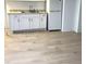 Well-lit kitchenette with granite counters, modern sink and white appliances at 123 Barclay Rd, Chapel Hill, NC 27516