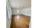 Bright living room boasts hardwood floors, natural light, and modern ceiling fan at 123 Barclay Rd, Chapel Hill, NC 27516