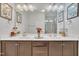 Neutral toned bathroom with a double sink vanity, white countertops, and a glass enclosed shower at 123 Carbone Ln, Clayton, NC 27527