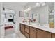 Spacious bathroom with double sink vanity, decorative mirrors, and a separate water closet and shower at 123 Carbone Ln, Clayton, NC 27527