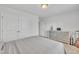 A bright bedroom features a closet, gray dresser, and a gray bedspread at 123 Carbone Ln, Clayton, NC 27527
