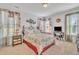 Cozy bedroom featuring floral bedding, plush carpet, and windows providing plenty of natural light at 123 Carbone Ln, Clayton, NC 27527