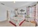 Spacious bedroom features neutral carpet, white walls, and a floral comforter with plenty of natural light at 123 Carbone Ln, Clayton, NC 27527