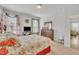 Bedroom showcasing plush carpet, a floral bedspread, and wood furniture in a neutral color palette at 123 Carbone Ln, Clayton, NC 27527