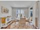 Sun-filled dining room featuring wood floors, neutral decor, and sliding glass door access to the yard at 123 Carbone Ln, Clayton, NC 27527