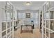 Bright home office features glass French doors, desk, and natural light streaming through the windows at 123 Carbone Ln, Clayton, NC 27527