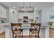 Bright kitchen features granite counters, stainless appliances, and an island with seating at 123 Carbone Ln, Clayton, NC 27527