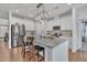 Modern kitchen featuring stainless steel appliances, granite countertops, a spacious island, and stylish pendant lighting at 123 Carbone Ln, Clayton, NC 27527