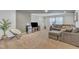 Spacious living room with gray walls, plush sectional sofa, and a large television at 123 Carbone Ln, Clayton, NC 27527