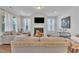 Inviting living room with a fireplace, comfortable seating, and large windows offering ample natural light at 123 Carbone Ln, Clayton, NC 27527