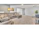Comfortable living room boasts plush sectional, modern art, and plenty of space to relax at 123 Carbone Ln, Clayton, NC 27527