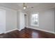 This bedroom offers hardwood floors, neutral paint and natural light from the window at 1239 Brogden Rd, Smithfield, NC 27577