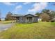 Charming one-story home with a covered carport and a well-maintained lawn at 1239 Brogden Rd, Smithfield, NC 27577
